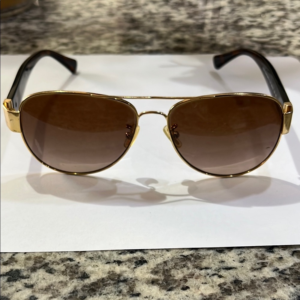 Coach Gold and Brown Aviator Sunglasses.